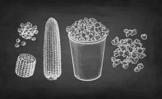 Popcorn in cup. Corncob and handful of corn kernels. Chalk sketch set on blackboard background. Hand drawn vector illustration. Retro style.