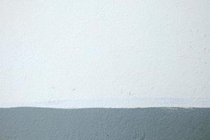 White and Gray Painting on Concrete Wall Texture Background. photo