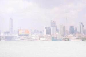 White Concrete Floor with Blurred Scenery of Cityscape Background. photo