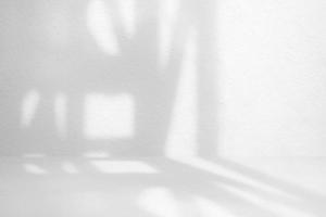 White Raw Concrete Room with Light Beam and Shadow from the Window Background. photo