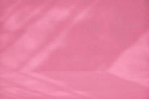 Pacific Pink Room with Stucco Wall Texture Background with Light Beam and Shadow, Suitable for Product Presentation Backdrop, Display, and Mock up. photo