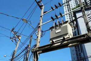 Close up High Voltage Transformer with Blue Sky. photo