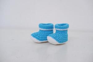 cute baby crochet shoes as a background photo