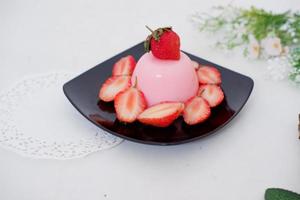 Pudding with delicious strawberries as a background photo