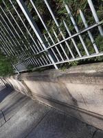 metal fence and pavement dutch angle photo