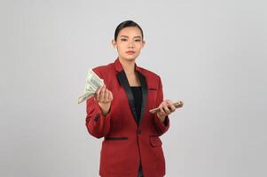 Young beautiful woman in formal clothing for officer with banknote in hands photo