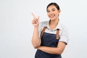 Portrait Asian young woman smile with happy in waitress uniform photo
