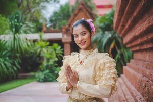 Portrait beautiful woman in Songkran festival with Thai Traditional costume photo