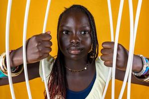 beautiful african teen girl is breaking prison bars photo