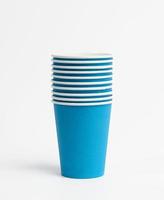 blue paper disposable cups on a white background photo