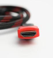 twisted cable in a textile black sheath on a white background, hdmi adapter photo