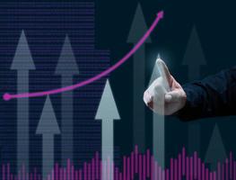 business graph of the dynamics of indicators and a man's hand points a finger to the highest column, dark blue background. Business growth and other parameters concept photo