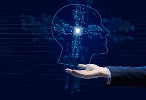 The concept of teaching artificial intelligence to various tasks, replacing human mental labor. Above the female hand is a luminous hologram of the head with connections photo
