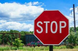 Stop sign at railway crossing photo