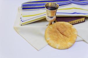 Chalice with red wine bread and Holy Bible photo