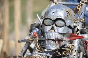 Skull welded from iron as a design element on a motorcycle. photo