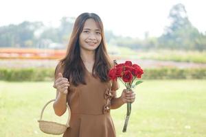 Asian woman smiling happily green grass background photo