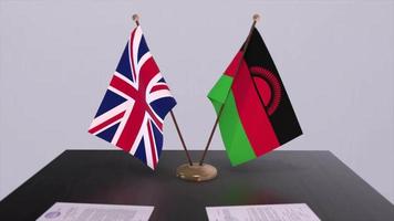 Malawi and UK flag. Politics concept, partner deal between countries. Partnership agreement of governments video