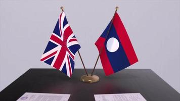 Laos and UK flag. Politics concept, partner deal between countries. Partnership agreement of governments video