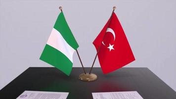 Nigeria and Turkey flags at politics meeting. Business deal video