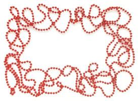 Red beads around like frame on white background. Empty space for text in the middle. Flat lay for Valentines Day or holidays. photo