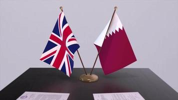 Qatar and UK flag. Politics concept, partner deal between countries. Partnership agreement of governments video