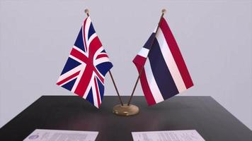 Thailand and UK flag. Politics concept, partner deal between countries. Partnership agreement of governments video