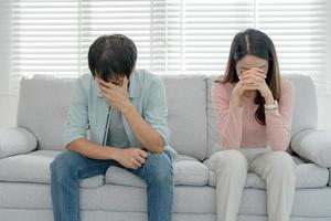 Divorce. Asian couples are desperate and disappointed after marriage. Husband and wife are sad, upset and frustrated after quarrels. distrust, love problems, betrayals. family problem, teenage love photo