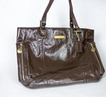 Leather bag with gold-plated hardware and high handles. no logo. part3