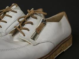 White shoes with cork soles and brown laces. many parts with different angles. part4 photo