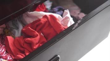 Cloths in a open drawer wooden . video