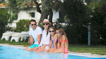 Happy family in swimming pool video