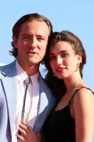 LOS ANGELES  MAY 4 - Lewis Pullman, Rainey Qualley at the Top Gun - Maverick World Premiere at USS Midway on May 4, 2022 in San Diego, CA photo