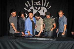 LOS ANGELES, JUN 18 -  Linkin Park, Mike Shinoda, Rob Bourdon, Joe Hahn, Brad Delson, Dave Farrell, Chester Bennington at the Linkin Park Rockwalk Inducting Ceremony at the Guitar Center on June 18, 2014 in Los Angeles, CA photo