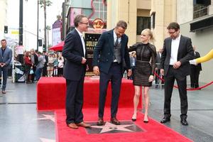 LOS ANGELES, DEC 15 - Rhett Reese, Ryan Reynolds, Anna Faris, Paul Wernick at the Ryan Reynolds Hollywood Walk of Fame Star Ceremony at the Hollywood and Highland on December 15, 2016 in Los Angeles, CA photo