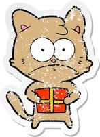 distressed sticker of a cartoon cat with present vector