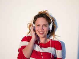 relaxed young woman at home working on laptop photo