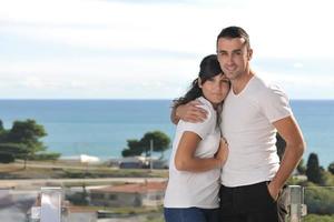 couple relaxing on balcony photo