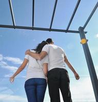 couple relaxing on balcony photo