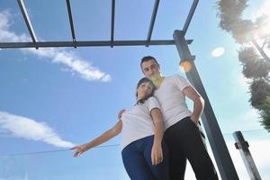 couple relaxing on balcony photo