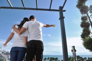 couple relaxing on balcony photo