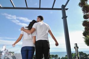 couple relaxing on balcony photo