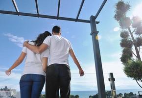 couple relaxing on balcony photo