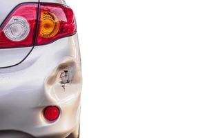 car has dented rear bumper damaged after accident isolated on white photo