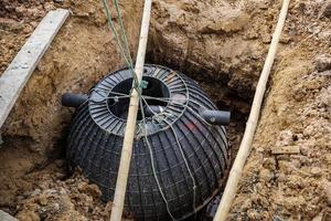 septic tank installation into the ground photo