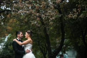 Beautiful wedding couple posing photo