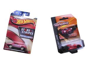 A Hot Wheels Chevy Camaro die cast toy car and a Majorette Nissan Concept 2020 Vision Gran Turismo diecast toy car isolated on white background. photo