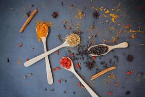 Cinnamon and spices on dark background. photo