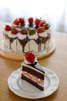 Chocolate cake with strawberry and whipping cream. Homemade bekery concept. photo