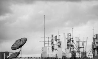 Telecommunication equipment for 5g radio network. Telecommunication tower, antenna, and satellite dish. Antenna for wireless network. Broadcasting tower for internet communication. Broadcast antenna. photo